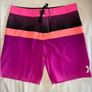 Men’s Hurley neon pink board shorts; size 34
